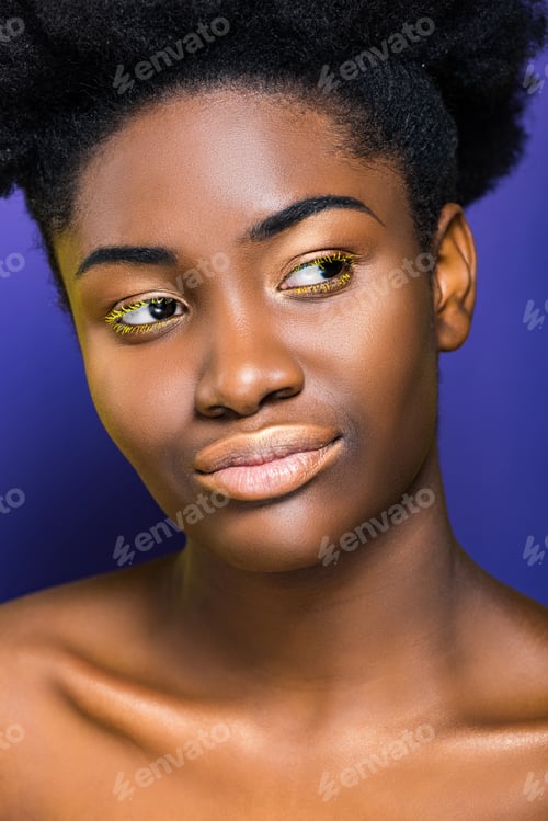 Preview: beautiful african american young woman with yellow eyelashes on purple