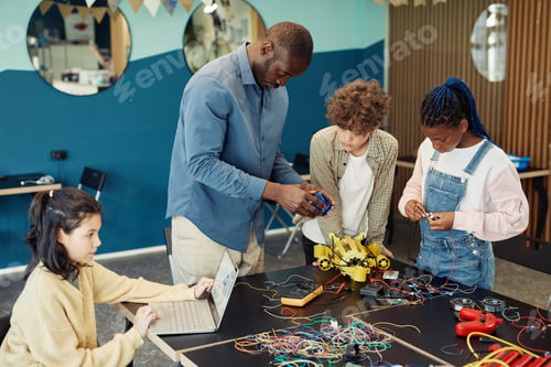 Preview: Teacher with Kids in Robotics Class