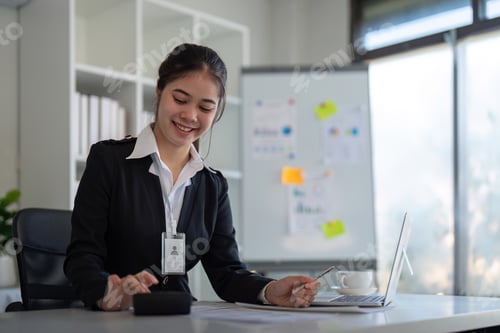Preview: Business accounting woman counting on calculator working on financial document in hands closeup