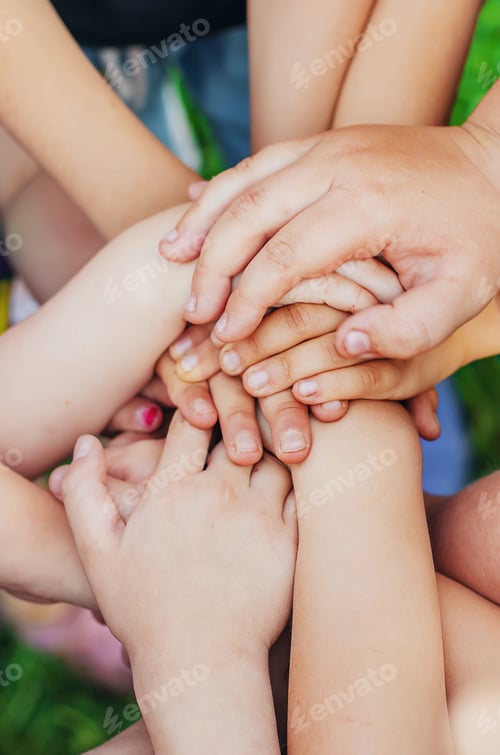 Preview: Children's hands together, street games. Selective focus.