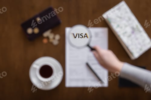 Preview: Visa application form on a wooden table, visa processing, registration, flat lay
