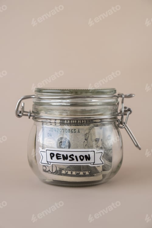 Preview: Saving Money In Glass Jar filled with Dollars banknotes. PENSION transcription in front of jar