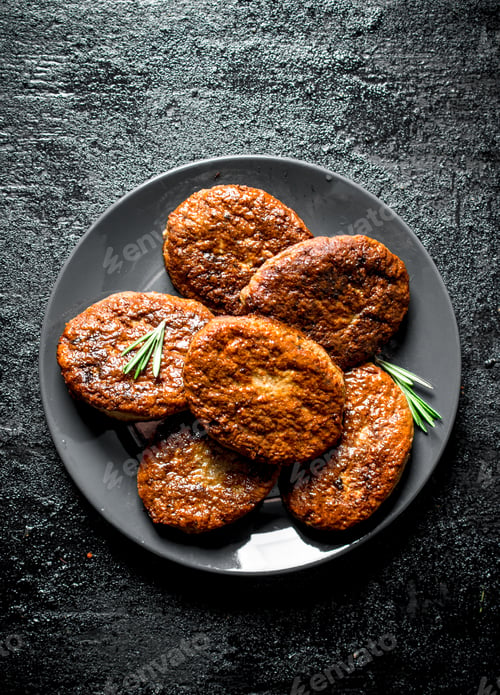 Preview: Cutlets on a plate with rosemary.