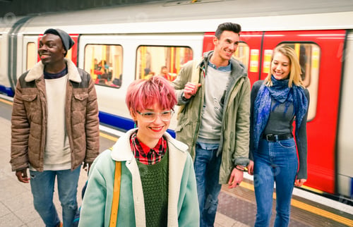 Preview: Multiracial group of hipster friends having fun in tube subway station