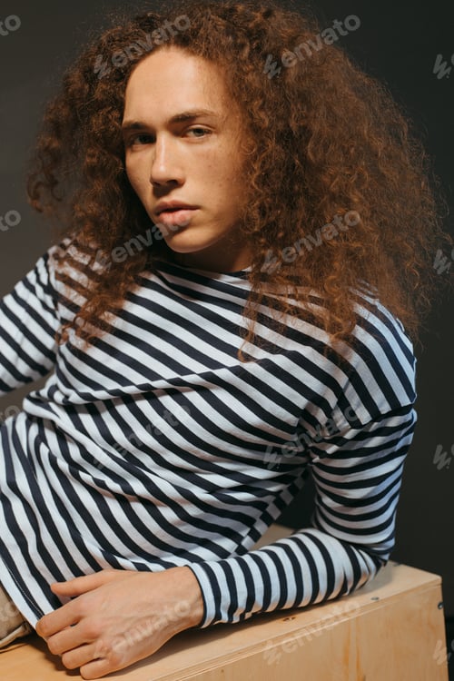 Preview: Portraits Of A Guy With An Attractive Appearance, Curly Hair And Stylish Clothes