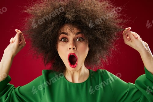 Preview: Pretty young female with curly hair grimace posing emotion red background unaltered