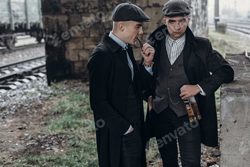 Preview: Posing on background of railway with bottle of alcohol