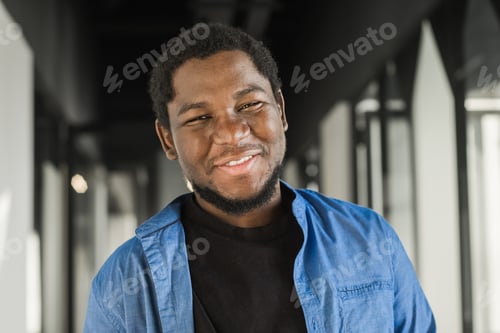 Preview: Portrait of happy African American small business owner. Millennial black male team leader smiling
