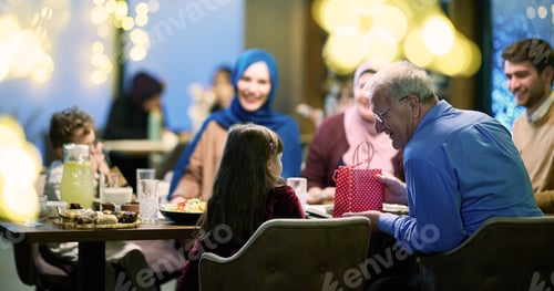 Preview: Grandparents arrive at their children's and grandchildren's gathering for iftar in a restaurant