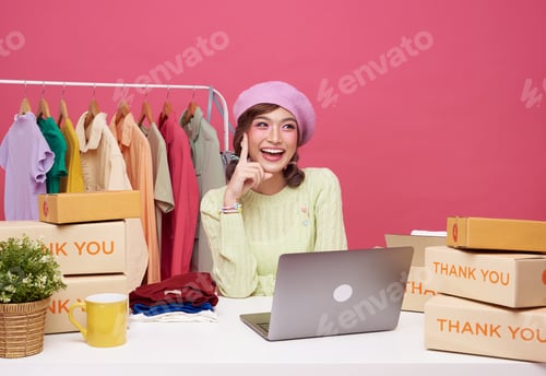 Preview: asian woman startup small business sale fashion clothing with parcel box and laptop on table