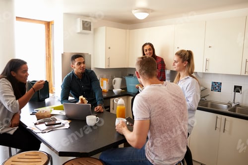 Preview: Students Relaxing In Kitchen Of Shared Accommodation
