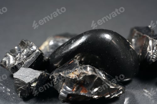 Preview: Closeup of obsidian pieces on the gray background