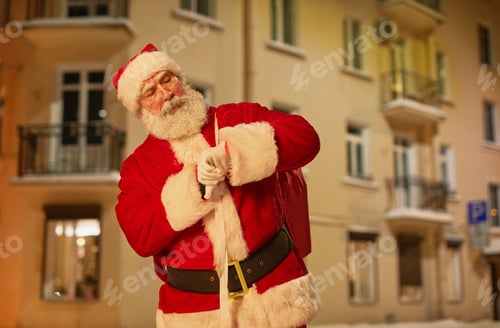 Preview: Santa Claus Carrying Sack With Presents in City