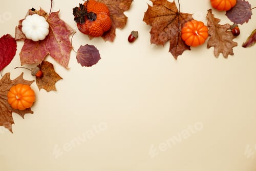 Preview: Autumn composition with maple leaves, decorative pumpkins and candles. Top view. Copy space
