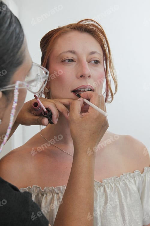 Preview: Woman Getting Makeup Applied Indoors