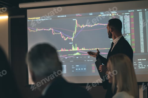 Preview: Financial Presentation with Graph Displayed On Projection Screen