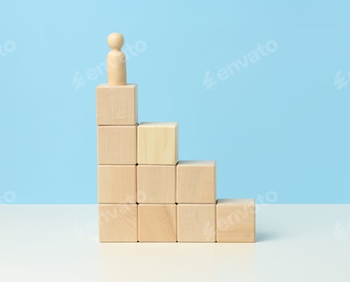 Preview: Wooden figurine of a man on top of wooden cubes