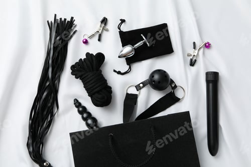 Preview: A collection of sex toys on a light background.