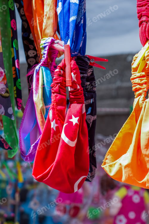 Preview: Selective focus shot of the headband with the Turkish flag on it under a sunlight