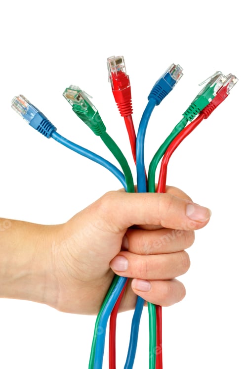 Preview: Bunch of different colored patch-cords gripped in fist