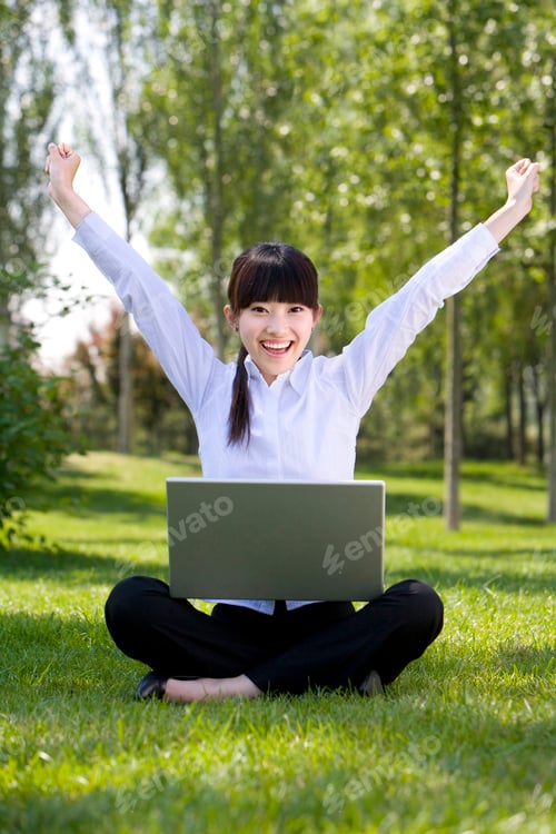 Preview: Chinese woman in park with laptop
