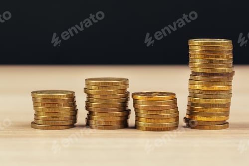 Preview: piles of coins on working table