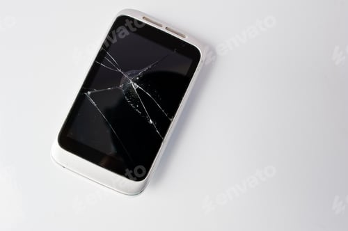 Preview: Broken screen of smart phone at white background