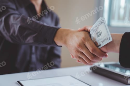 Preview: A corporate businessman shakes hands as a man gives and receives dirty cash to bribe a office, the i