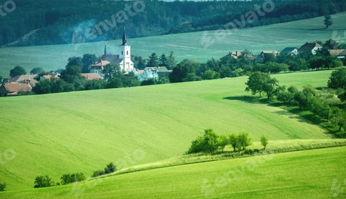 Preview: Sunshine landscape of green slopes and white castle