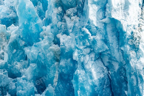 Preview: Closeup shot of the ice texture of a blue glacial wall in Inside Passage, Alaska