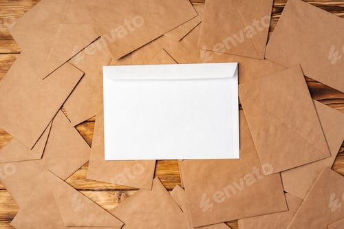 Preview: Stack of envelopes on working desk top view. Business mail