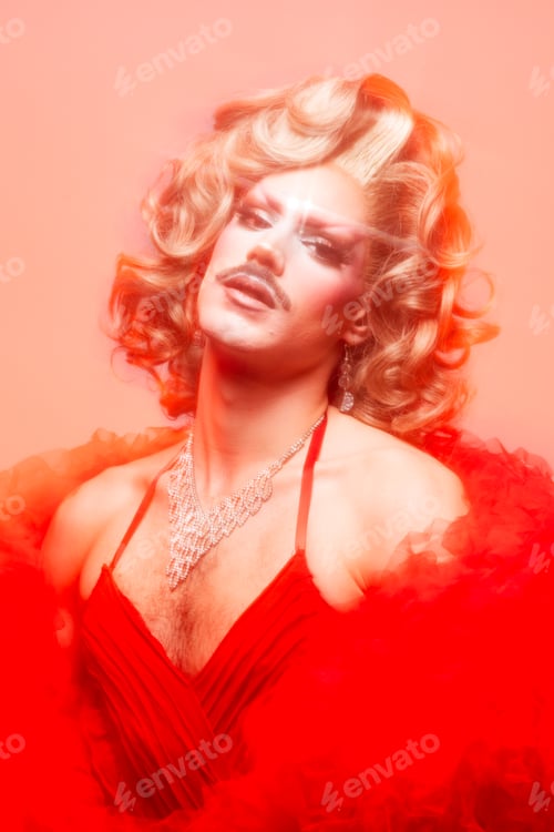 Preview: Glamorous Drag Queen Shines in a Vibrant Studio Setting With a Soft Focus Effect