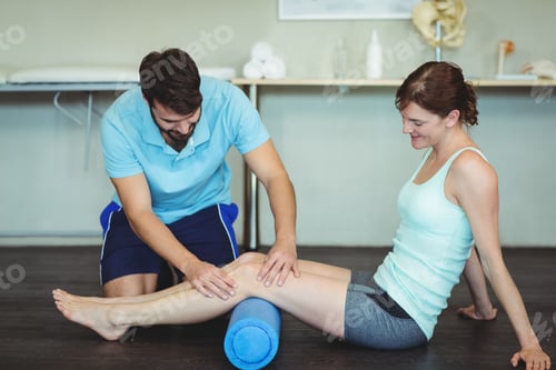 Preview: Woman Receives Leg Massage With Roller From Man