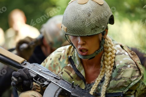 Preview: Caucasian Military lady woman in tactical gear posing for photo at summer season. Wearing green camo