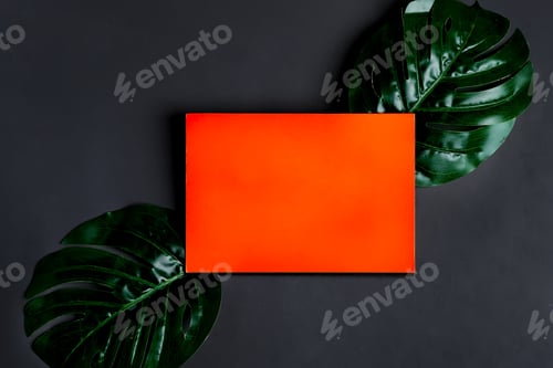 Preview: Red paper mock-up postcard with green palm leaves