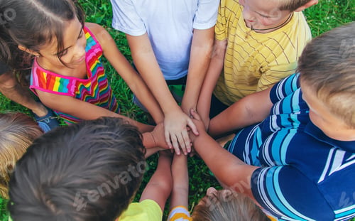 Preview: Children's friendship, children's hands on the street. Selective focus.