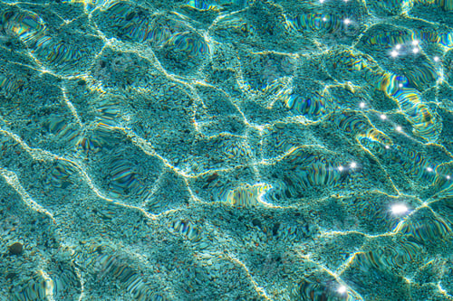 Preview: background of cristal clear blue waters with sand on the bottom