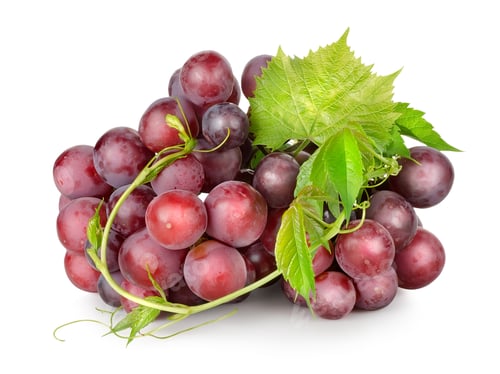 Bunch of Red Grapes With Green Leaves