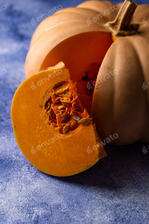 Preview: Raw fresh cut pumpkin on dark background
