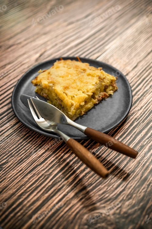 Preview: Plate with meat and grated potato pie on ceramic plate