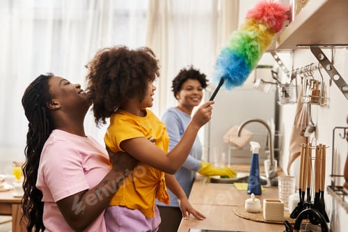 Preview: Family bonding while cleaning together in a cozy kitchen setting