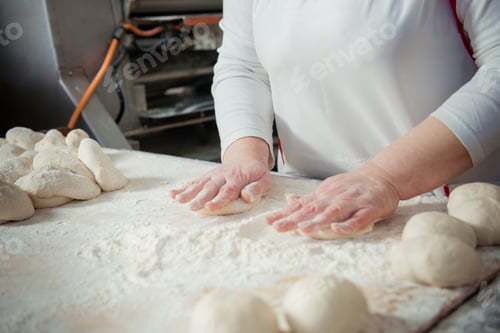 Preview: Woman baker make buns from dough