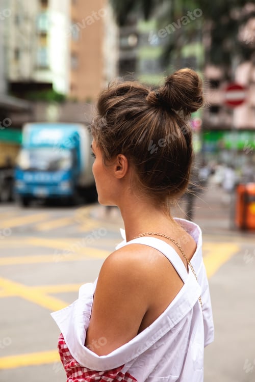 Preview: Woman Poses on City Street with Hair Up