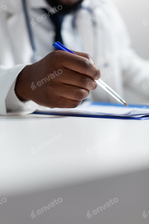 Preview: Closeup of african american physician doctor analyzing medicine prescription