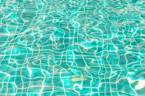 Preview: The sunlight on the surface of the water in the pool dimensional waves on water.