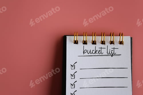 Preview: Top view image of notebook with text BUCKET LIST on pink background.