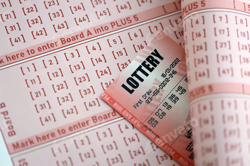 Preview: Red lottery ticket lies on pink gambling sheets with numbers for marking to play lottery
