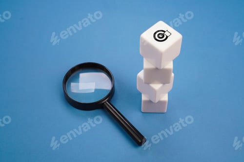 Preview: Stacked white blocks with target icon and magnifying glass