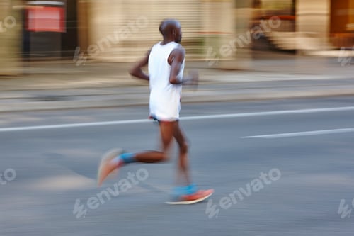 Preview: Marathon runner in motion on the street. Healthy lifestyle.