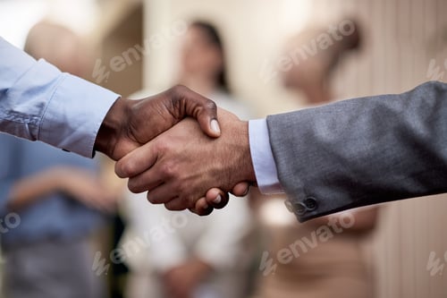 Preview: This is an historic partnership. Shot of two businessmen shaking hands in greeting.